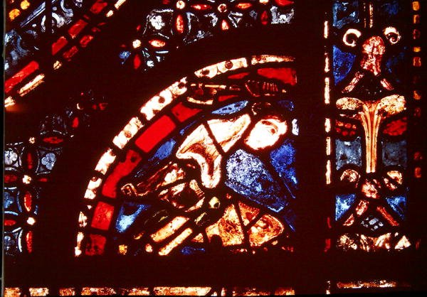 Een Slager, detail uit de rechterbenedenhoek van het Wonderen van de Maagd Raam in het zuidtransept van het schip, 1205-15 door French School