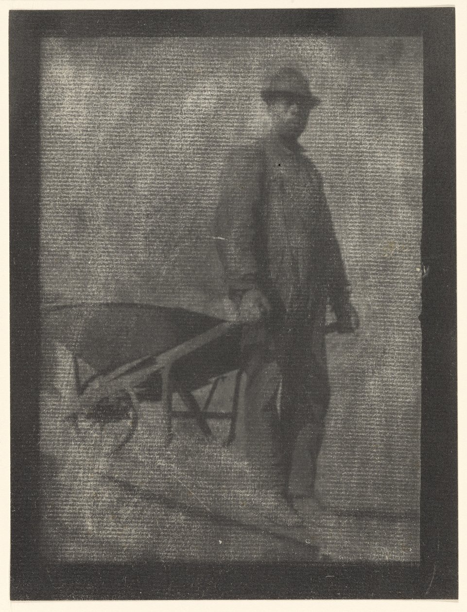 [Zwarte man met kruiwagen]. door Doris Ulmann