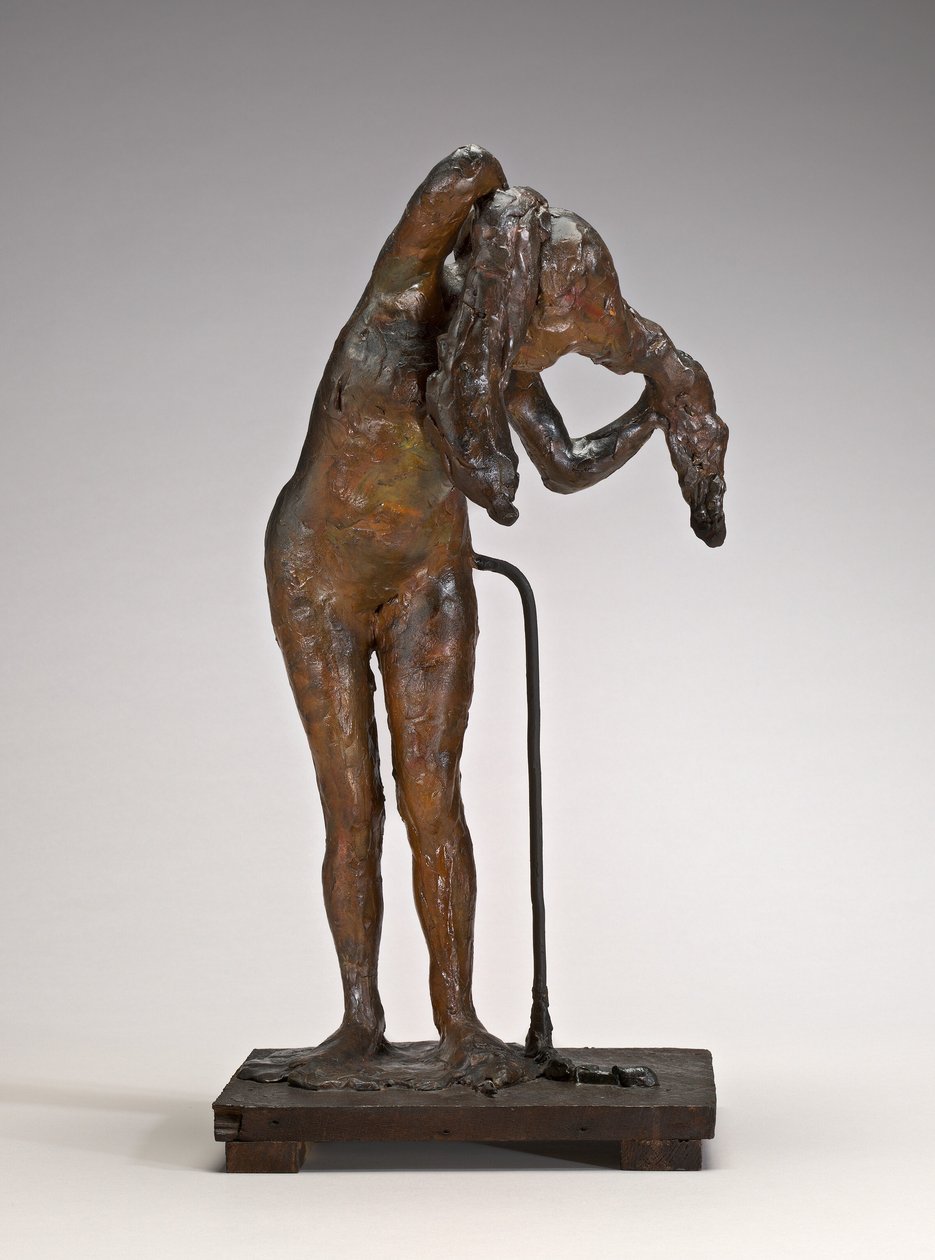 Vrouw die haar haar arrangeert door Edgar Degas