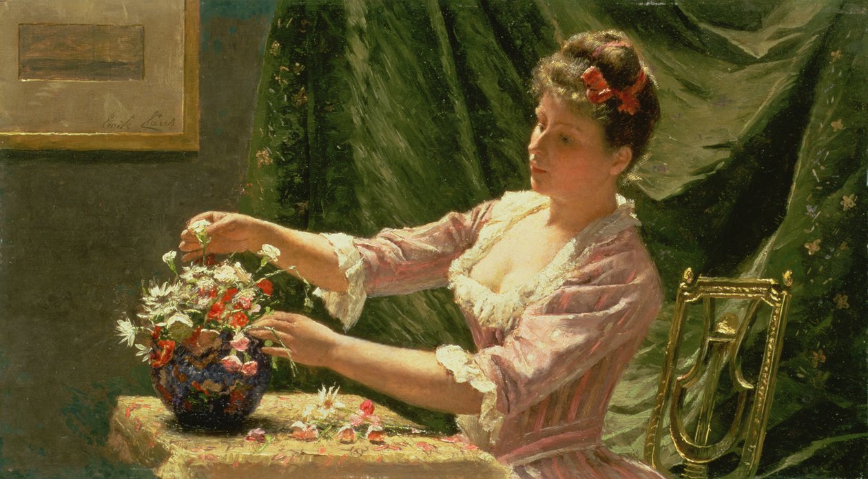 Jonge vrouw die bloemen rangschikt door Emile Claus