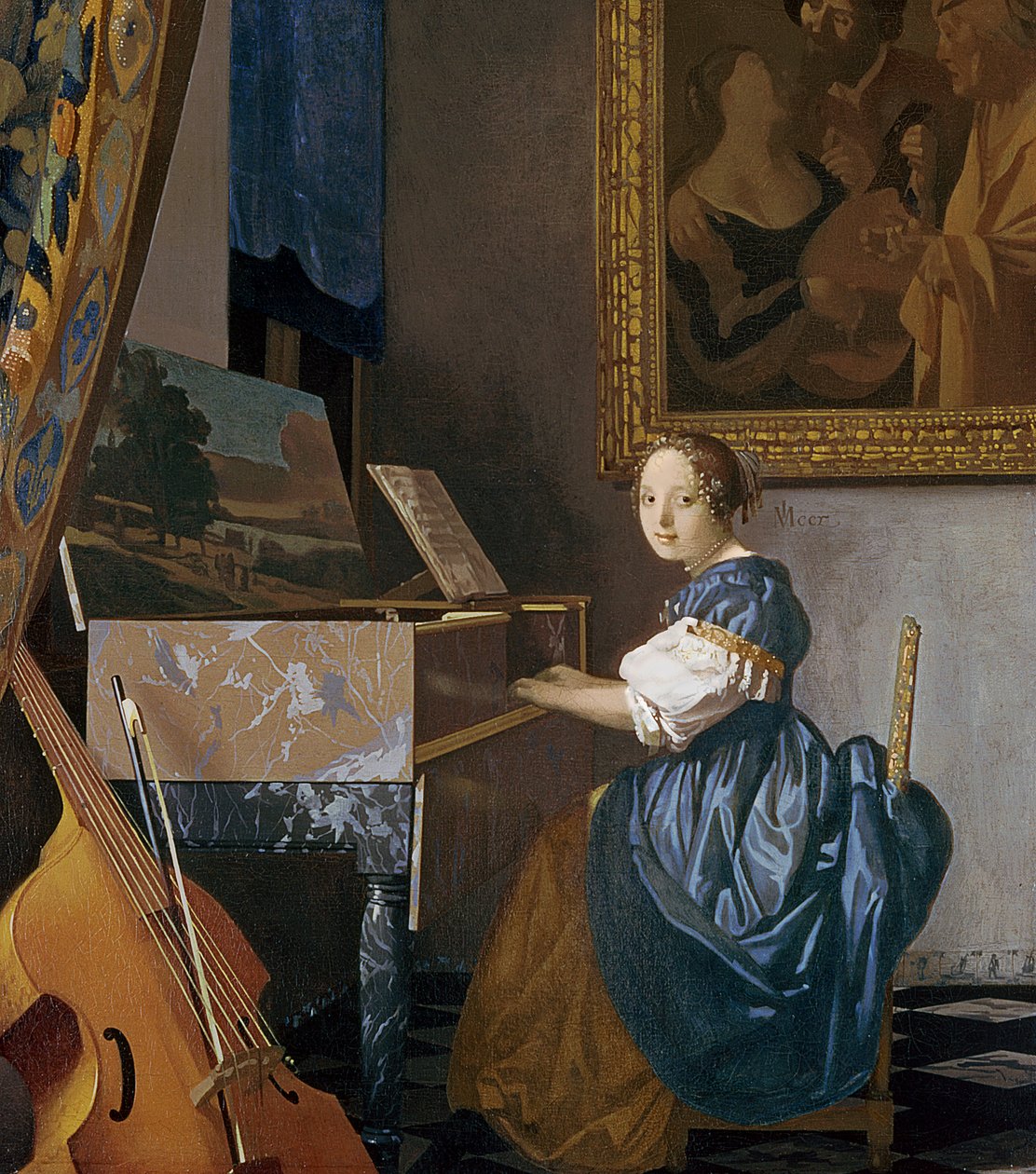 Een jonge dame zittend aan een virginaal, c.1670 door Jan Vermeer van Delft