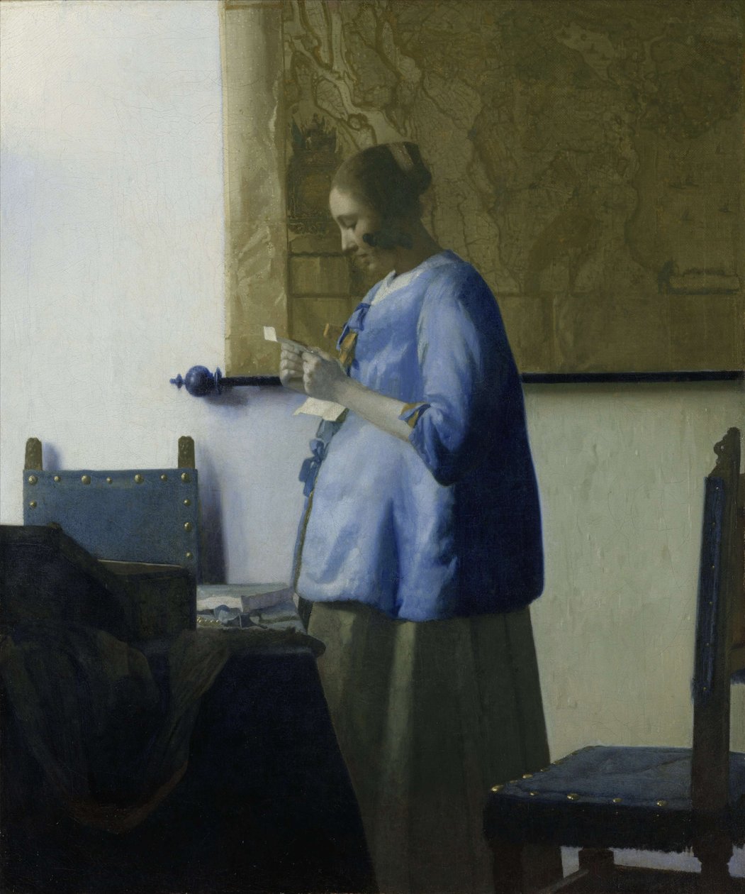 Vrouw in blauw die een brief leest door Jan Vermeer van Delft