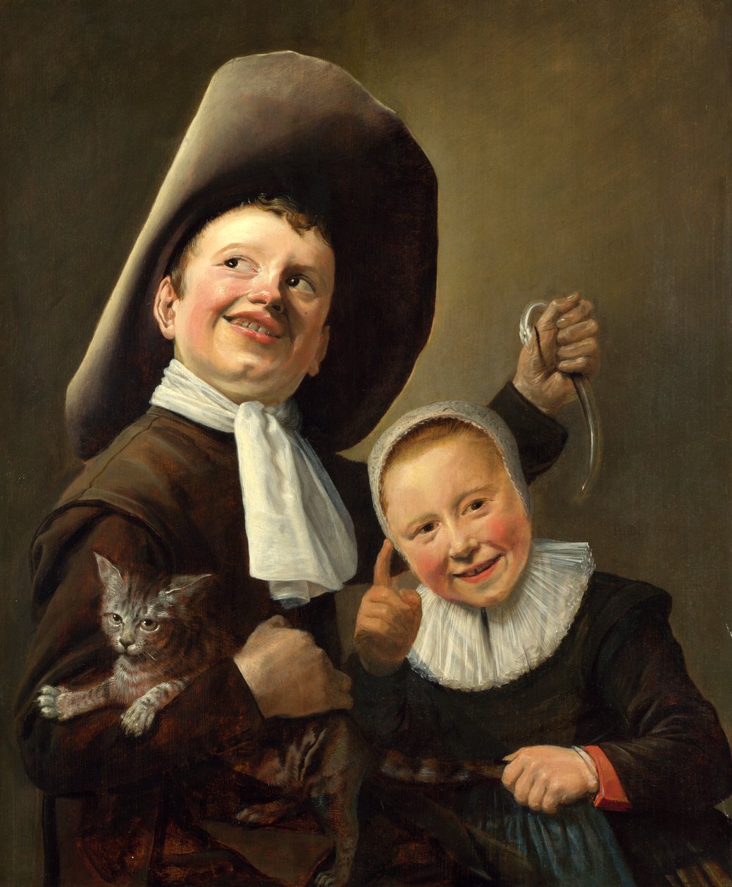 Een jongen en een meisje met een kat en een paling door Judith Leyster