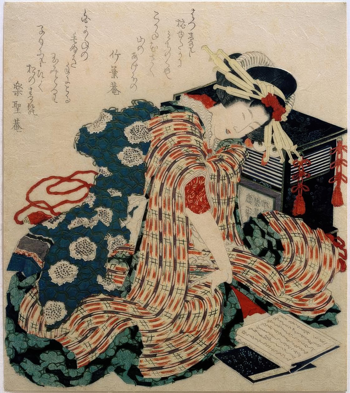 Jonge vrouw die het kussenboek leest door Katsushika Hokusai
