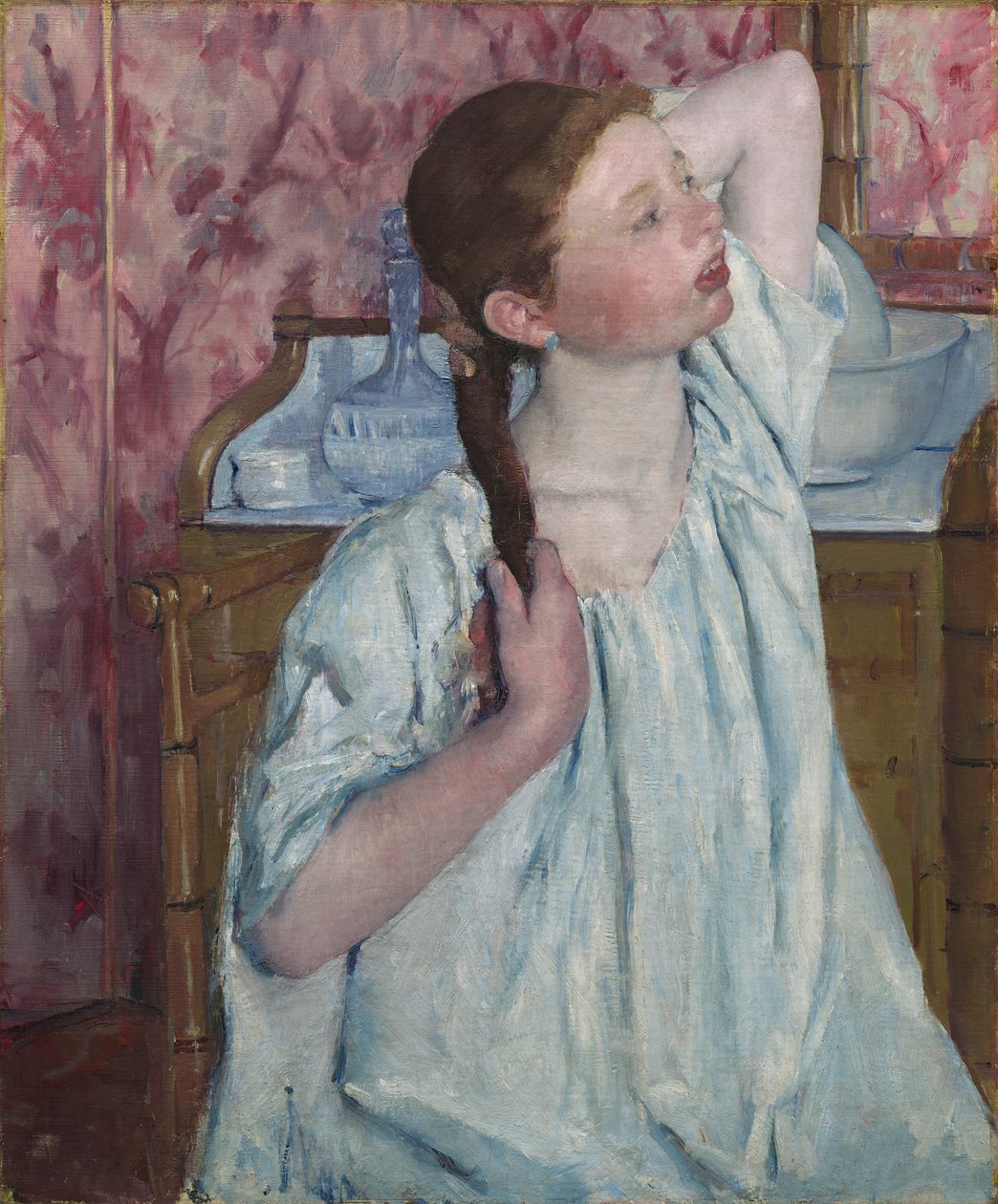 Meisje dat haar haar arrangeert door Mary Stevenson Cassatt