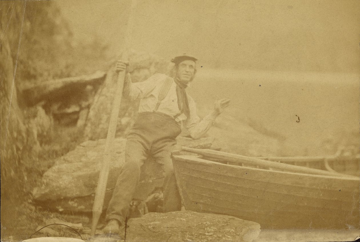 [Man poseert naast roeiboot]. door Unknown artist/maker