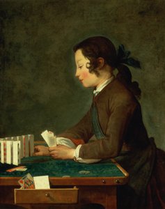 Jonge jongen die kaarten speelt